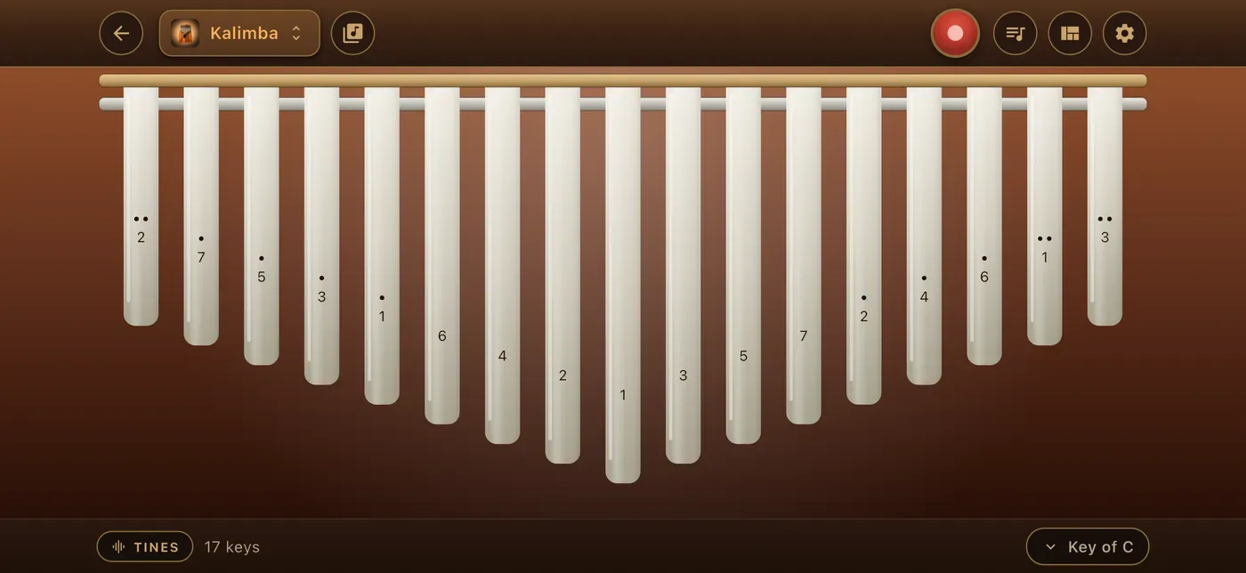 The kalimba room, seventeen tines under a brass rail.